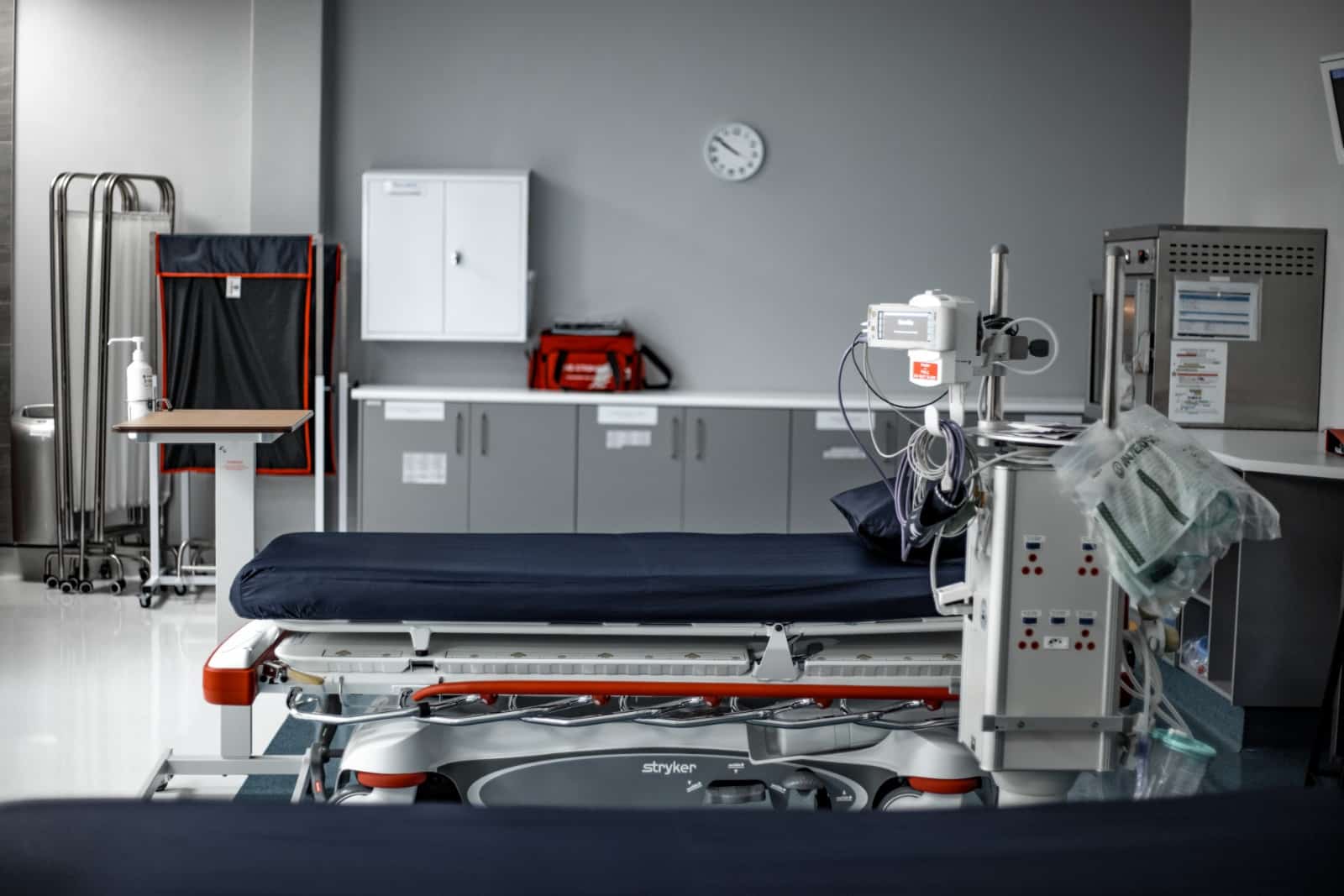 Close-up of a single resuscitation bed equipped for patient treatment.