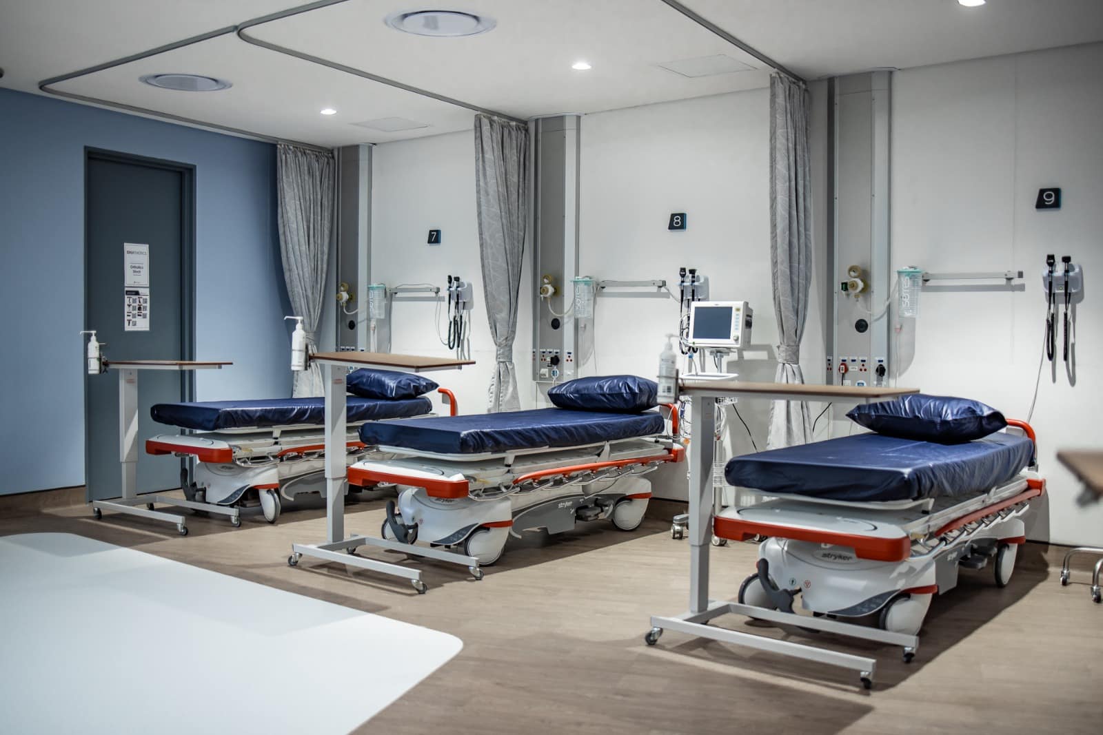 Emergency unit showing three resuscitation beds, ready for critical patient care.
